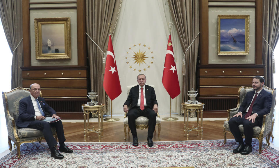 Turkey's President Recep Tayyip Erdogan, center, U.S. Commerce Secretary Wilbur Ross, left, and Berat Albayrak, Turkey's Finance Minister and Erdogan's son-in-law, before a meeting at the presidential palace, in Ankara, Turkey, Tuesday, Sept. 10, 2019. Turkey accused the United States on Tuesday of taking only "cosmetic steps" toward the creation of a so-called "safe zone" in northeast Syria and renewed Ankara's threat of unilateral military intervention to form a buffer area along its border.(Presidential Press Service via AP, Pool)