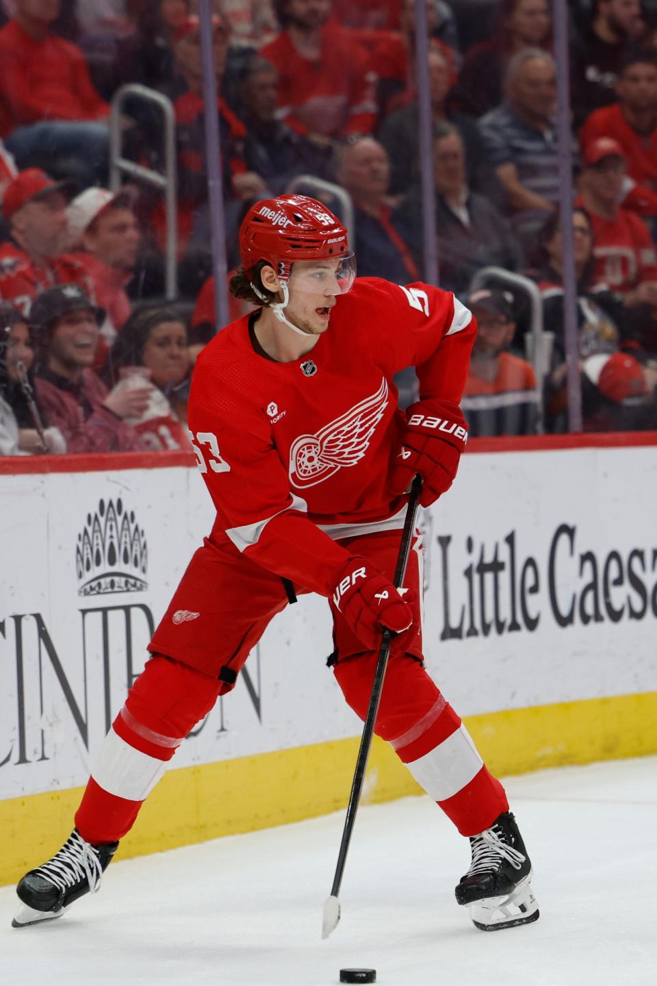 Red Wings defenseman Moritz Seider skates with the puck in the third period of the Wings' 2-1 loss to the Capitals on Tuesday, April 9, 2024, at Little Caesars Arena.