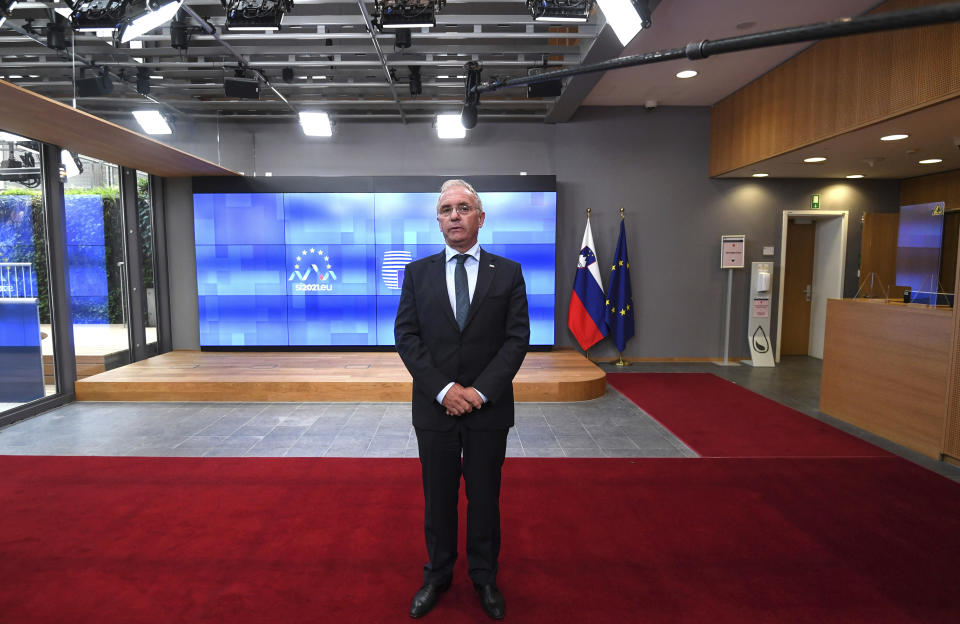 Slovenian Interior Minister Ales Hojs makes a statement upon arrival prior to an emergency ministerial meeting at the European Council building in Brussels, Wednesday, Aug. 18, 2021. European Union ministers are holding emergency talks Wednesday in response to allegations that Belarus is deliberately sending migrants to Lithuania as part of a "hybrid warfare" campaign to destabilize the Baltic EU member country. (John Thys, Pool Photo via AP)