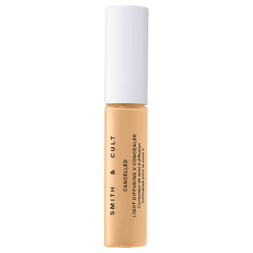 A tube of beige concealer with a white lid.