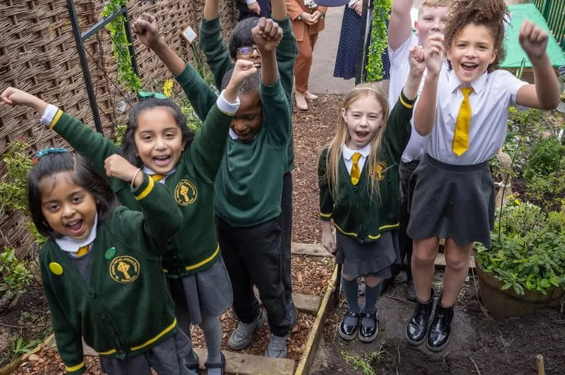 Children from St Joseph's Catholic Primary School buried Vernon Building Society's time capsule in their peace garden