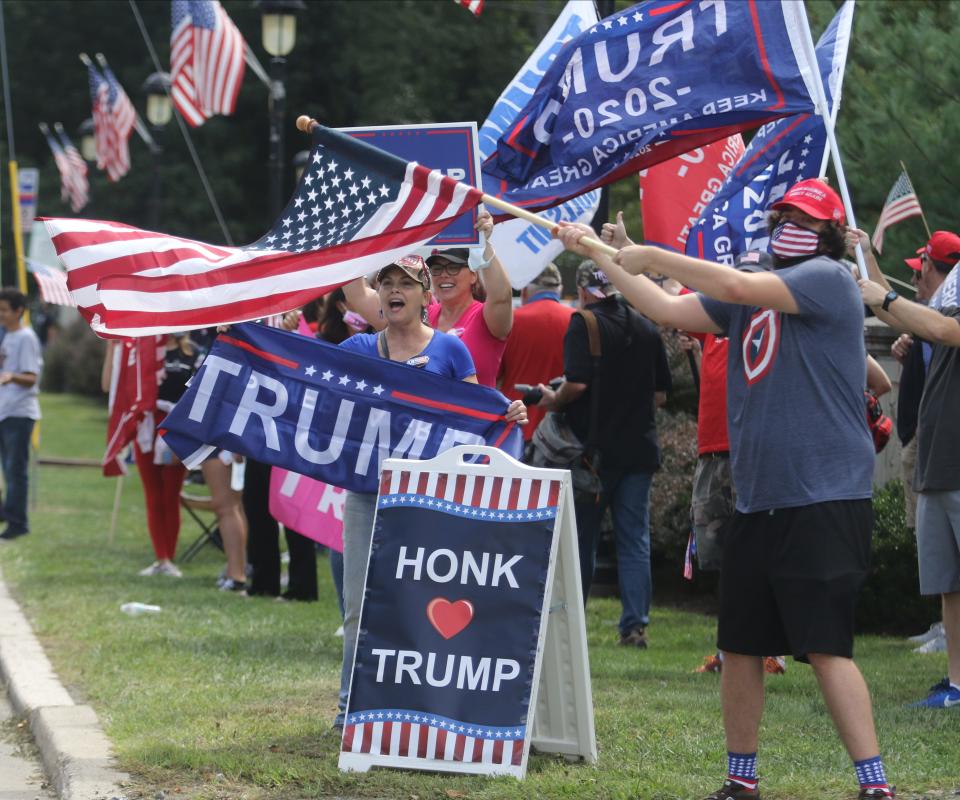 Supporters of President Donald Trump encourage vehicles to honk support in 2020.