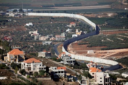 FILE PHOTO: A general view picture shows the Lebanese village of Adaisseh on the left-hand-side of the Israel-Lebanon border, as seen from Kibbutz Misgav Am in northern Israel