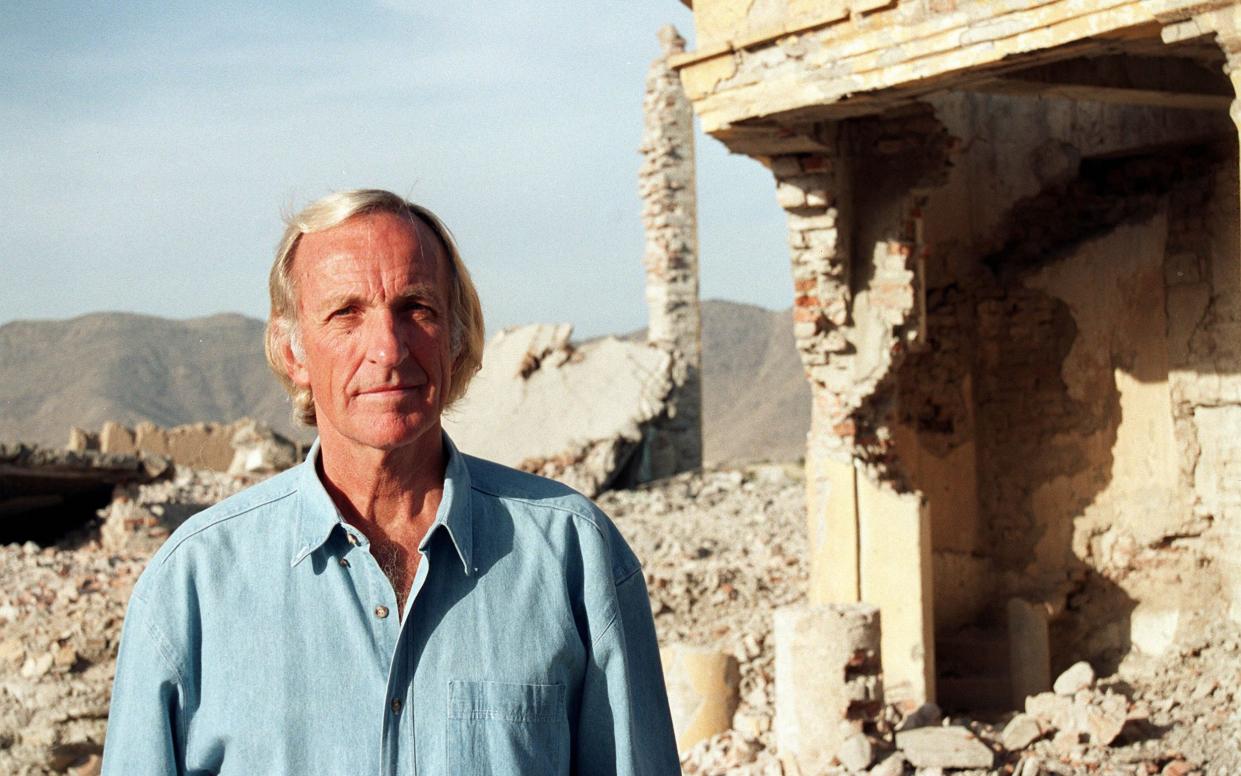 John Pilger in the debris of Kabul in 2003