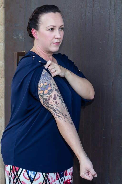 MJ Hegar of Texas, an Air National Guard veteran and 2018 Democratic candidate for the House of Representatives, shows the tattoos that she says helped her reclaim parts of her body that were scarred when her rescue helicopter was shot down in Afghanistan