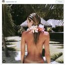 <p>Candice Swanepoel showed off her tan lines while on holiday.</p>