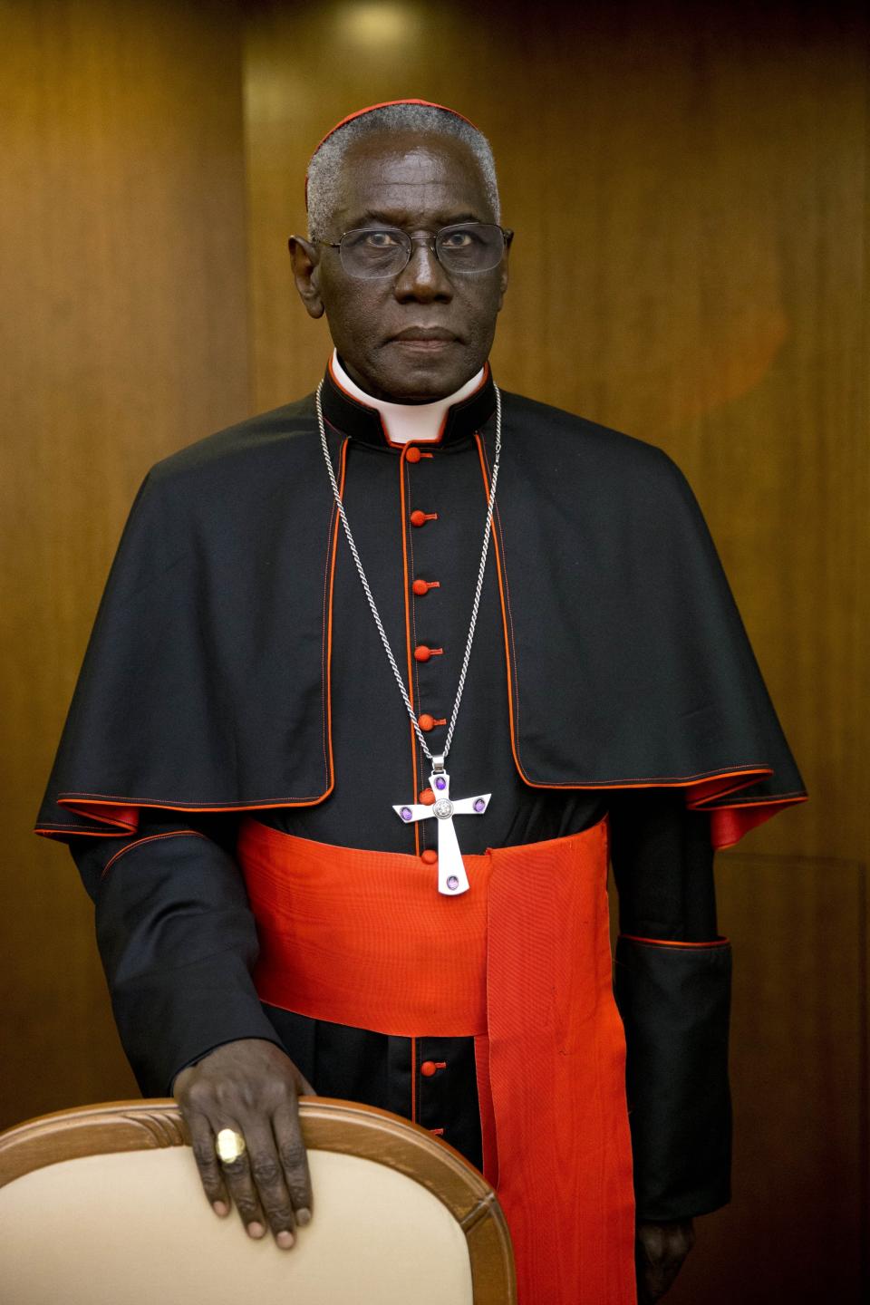 Cardinal Robert Sarah, prefect of the Congregation for Divine Worship and the Discipline of the Sacraments, arrives for the presentation of Cardinal Raymond Leo Burke's book Divine Love Made Flesh, in Rome, Wednesday, Oct. 14, 2015. The Vatican said Saturday it was “necessary and urgent” to return to in-person Masses as soon as coronavirus lockdowns permit. (AP Photo/Andrew Medichini)