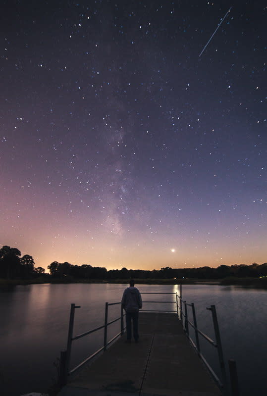 Astrophotographer Chris Bakley sent in a photo of an Orionid meteor from North Cape May, NJ. The shot was taken only a couple minutes after moonrise while the moon was still low on the horizon. The larger star in this picture is Venus, and the