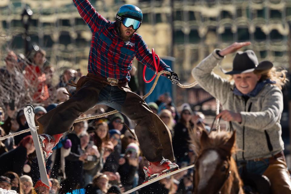 Scott Hoover skis behind Emalee Fowles riding Cheddar in a skijoring event, part of the Salt Lake Winter Roundup, on West Temple in downtown Salt Lake City on Saturday, Feb. 10, 2024. | Megan Nielsen, Deseret News