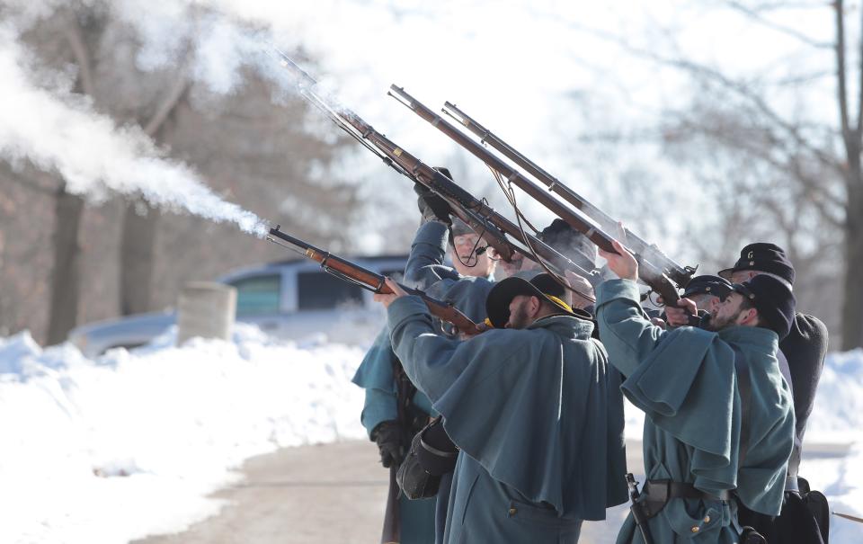 Civil War reenactors fire a salute with their rifles Saturday at the annual wreath-laying ceremony honoring the birthday of President William McKinley.