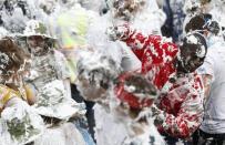 Students from St Andrews University are covered in foam as they take part in the traditional 'Raisin Weekend' in the Lower College Lawn, at St Andrews in Scotland, Britain October 17, 2016. REUTERS/Russell Cheyne