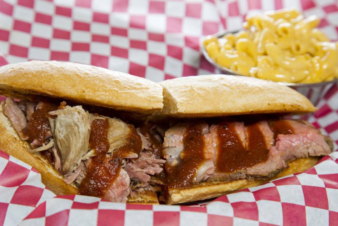 The Half Pork & Half Tri-Tip sandwich ($16) is “the best of both worlds on one roll,” the menu explains.