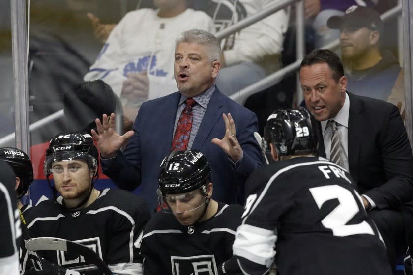 Los Angeles Kings head coach Todd McLellan and assistant coach Marco Sturm instruct from the bench.