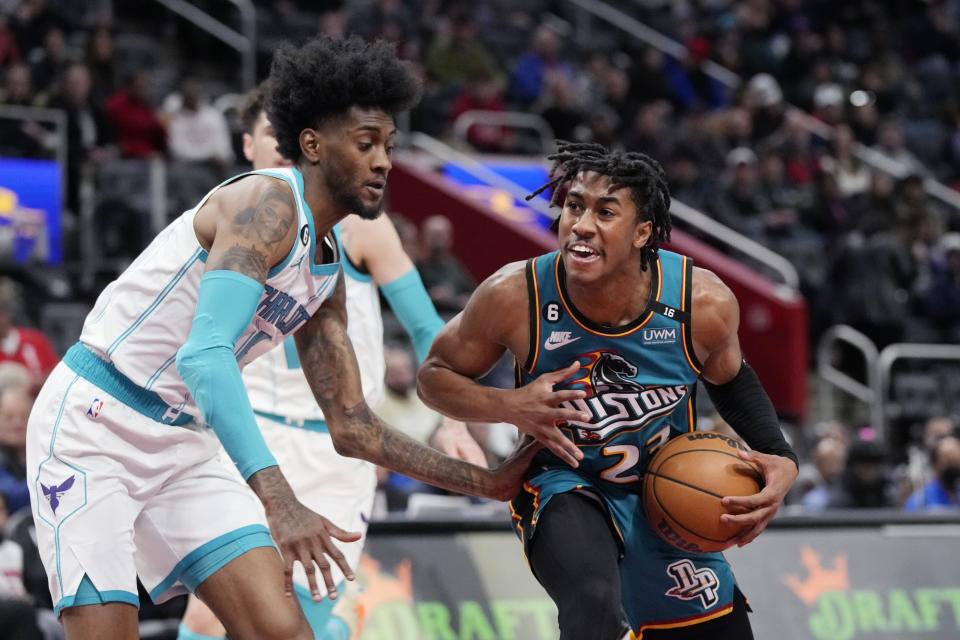 Detroit Pistons guard Jaden Ivey (23) drives as Charlotte Hornets forward Jalen McDaniels (6) defends during the first half at Little Caesars Arena in Detroit on Friday, Feb. 3, 2023.