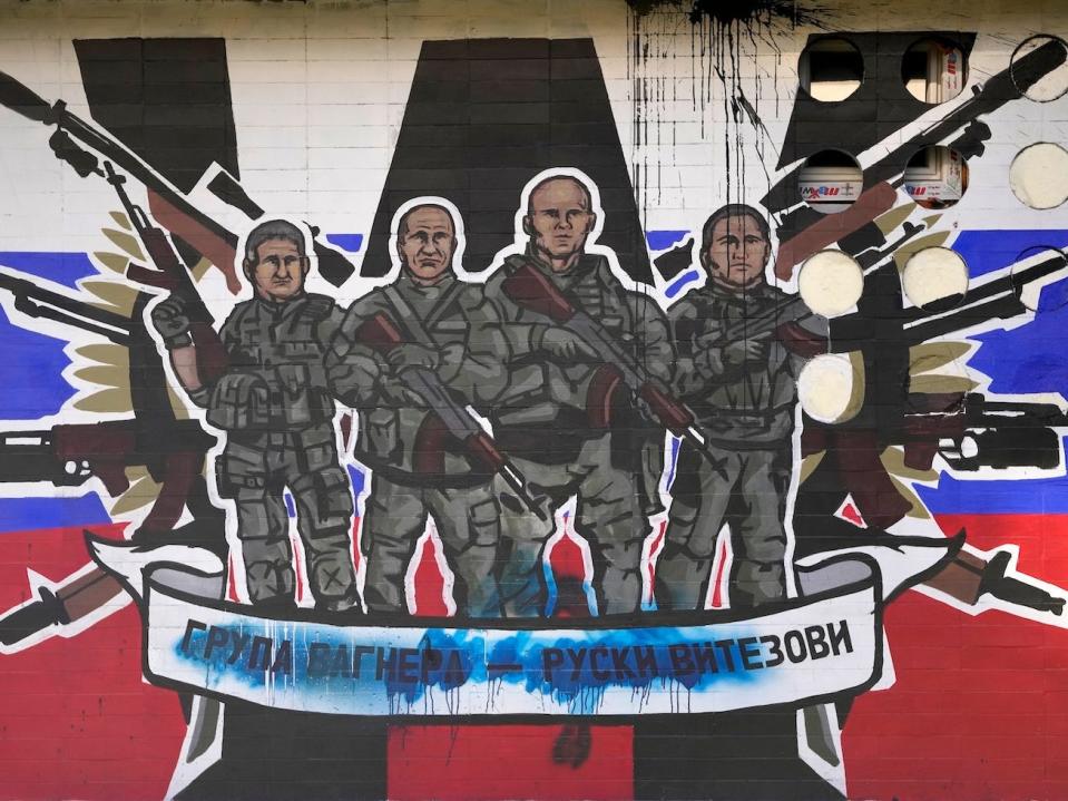 A mural depicting mercenaries of Russia's Wagner Group that reads: "Wagner Group — Russian knights."