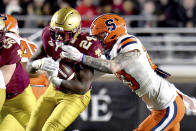 Syracuse's Justin Barron closes in on Boston College running back Pat Garwo for a tackle during the first half of an NCAA college football game Saturday, Nov. 26, 2022, in Boston. (AP Photo/Mark Stockwell)