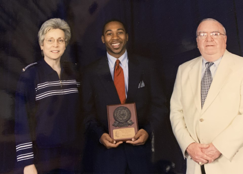 UCLA athletic director Martin Jarmond (center) receives the McLendon Minority Postgraduate Scholarship with North Carolina State athletic director Debbie Yow (left) and NACDA director Mike Cleary (right).