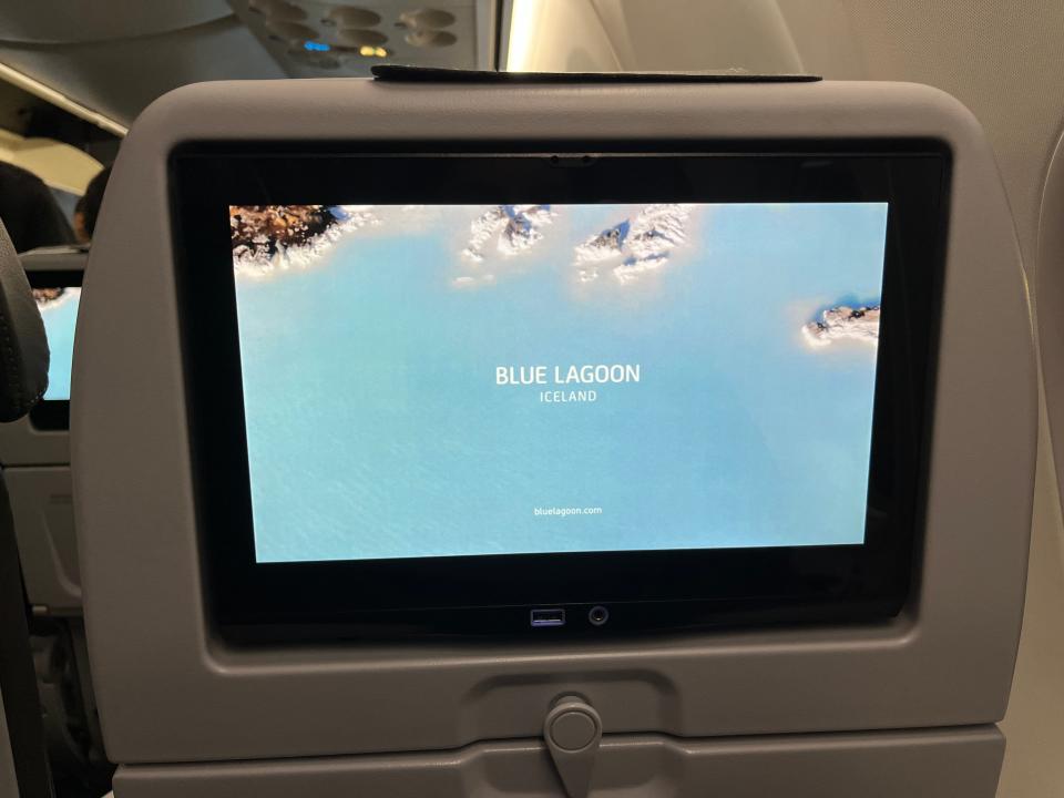 A screen advertises the Blue Lagoon on IcelandAir