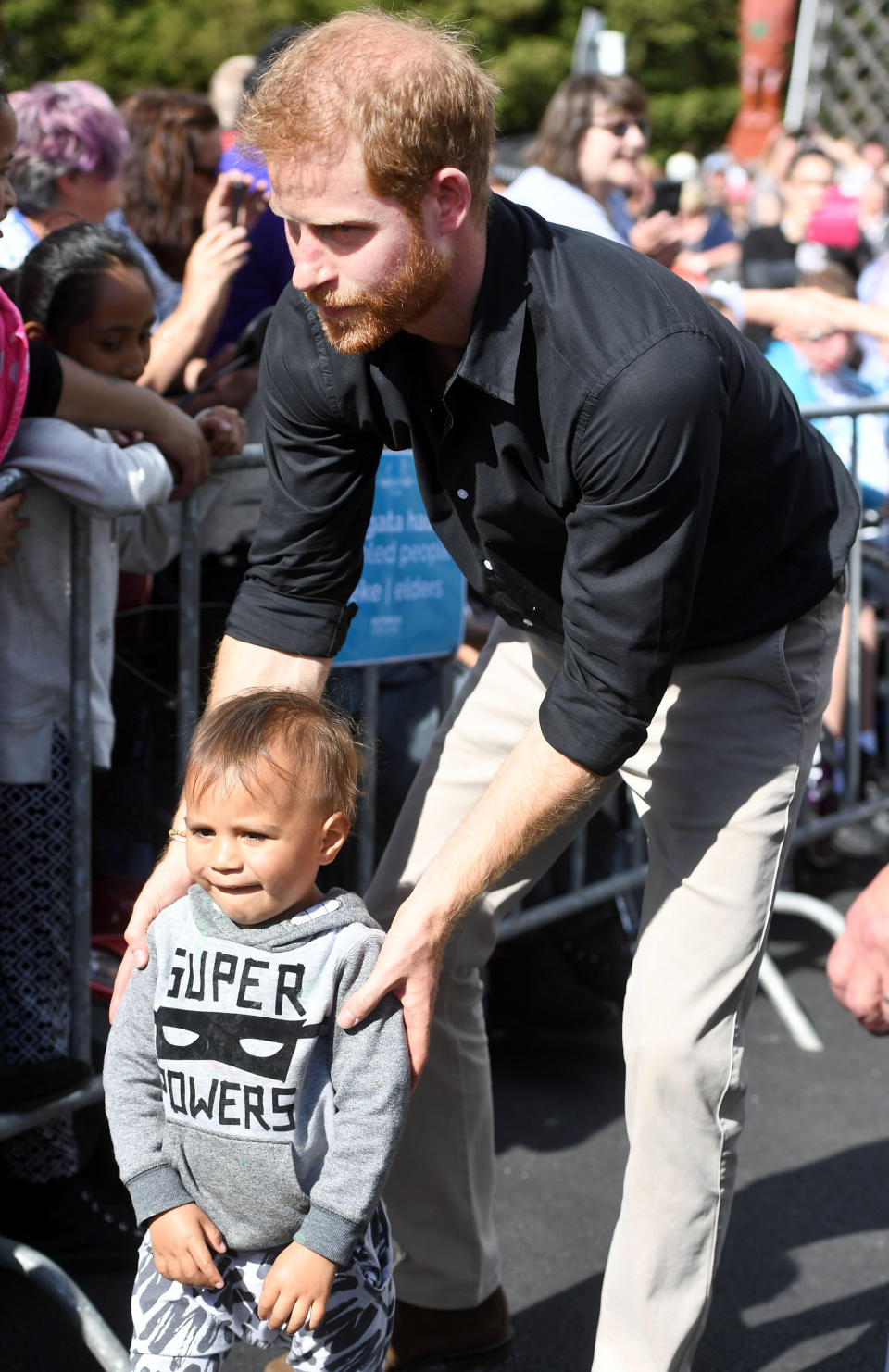 Prince Harry showed off his fatherly instincts in Rotorua yesterday, when he helped a lost little boy find his way back to his parents. Photo: Getty Images