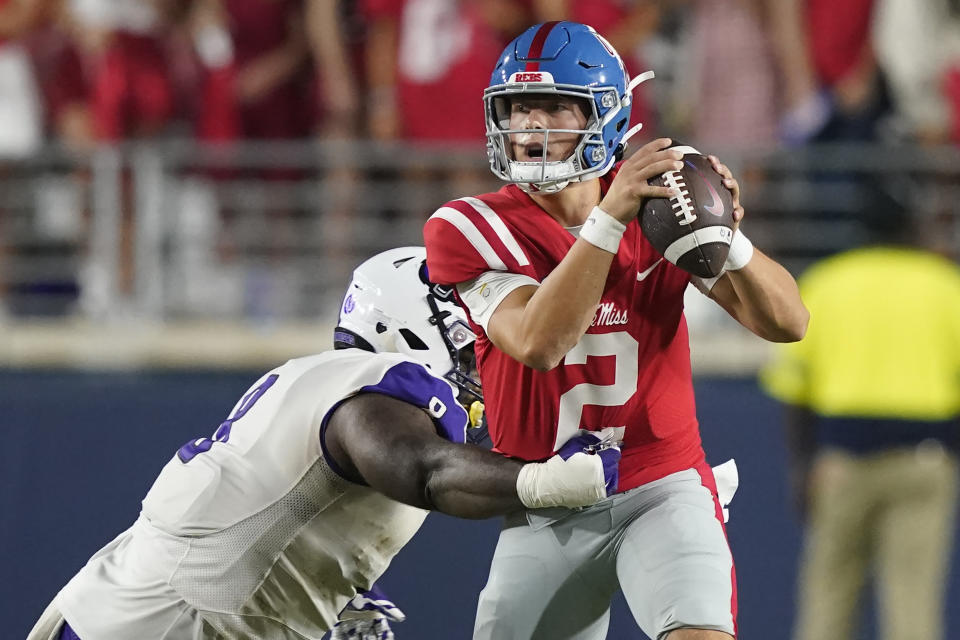 Central Arkansas defensive lineman Jalen Bedell, left, pressures Mississippi quarterback Jaxson Dart (2) who attempts to pass during the first half of an NCAA college football game in Oxford, Miss., Saturday, Sept. 10, 2022. (AP Photo/Rogelio V. Solis)