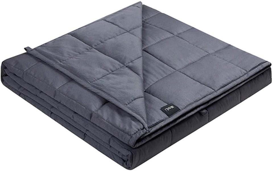 This blanket has two layers of microfiber and loops to secure a duvet cover. <a href="https://amzn.to/319D5IS" target="_blank" rel="noopener noreferrer">Originally $70, get it now for $55 at Amazon</a>.