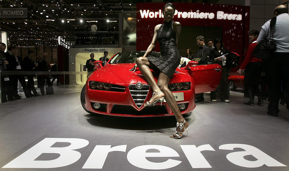 A model poses on an Alfa Romeo car