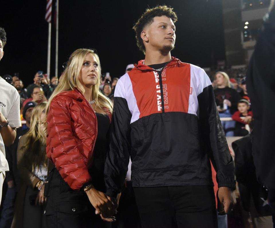 Patrick Mahomes, right, stands with his wife, Brittany Mahomes during his Ring of Honor ceremony, Saturday, Oct. 29, 2022, at Jones AT&T Stadium. 