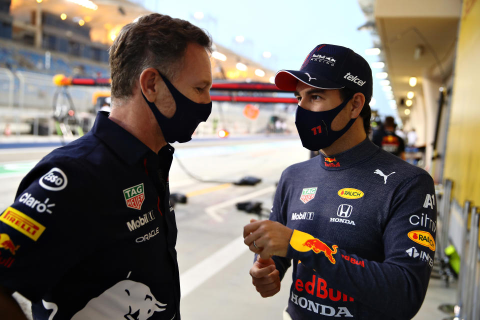 BAHRAIN, BAHRAIN - MARCH 26: Red Bull Racing Team Principal Christian Horner and Sergio Perez of Mexico and Red Bull Racing talk during practice ahead of the F1 Grand Prix of Bahrain at Bahrain International Circuit on March 26, 2021 in Bahrain, Bahrain. (Photo by Mark Thompson/Getty Images)