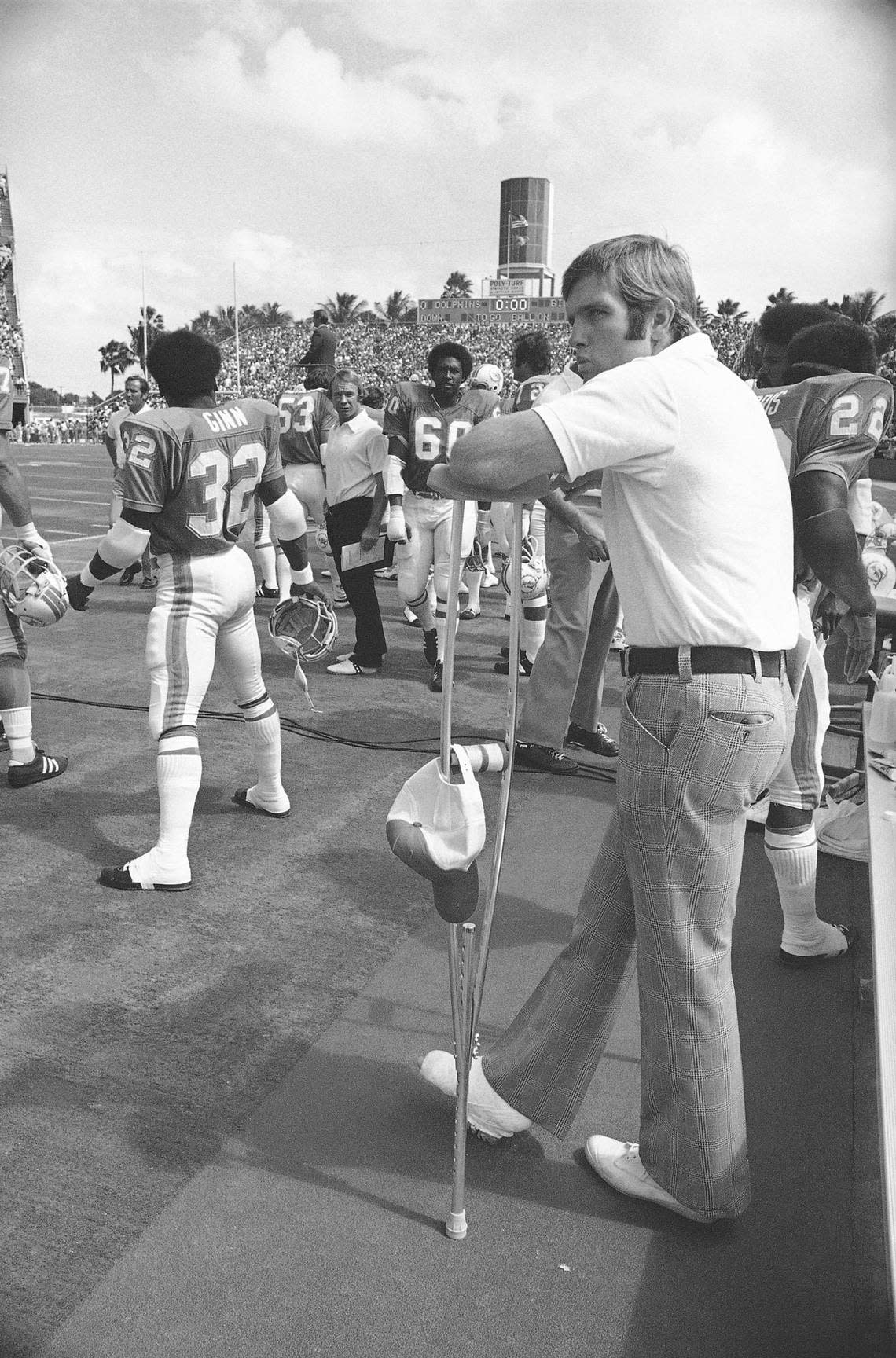 Miami star quarterback Bob Griese wears a forlorn look as he leans on his crutches in the Orange Bowl in Miami, Oct. 22, 1972, prior to the Dolphins-Buffalo Bills game. Griese sustained a broken right leg and dislocated ankle in last week’s game against San Diego. (AP Photo/Mark Foley)