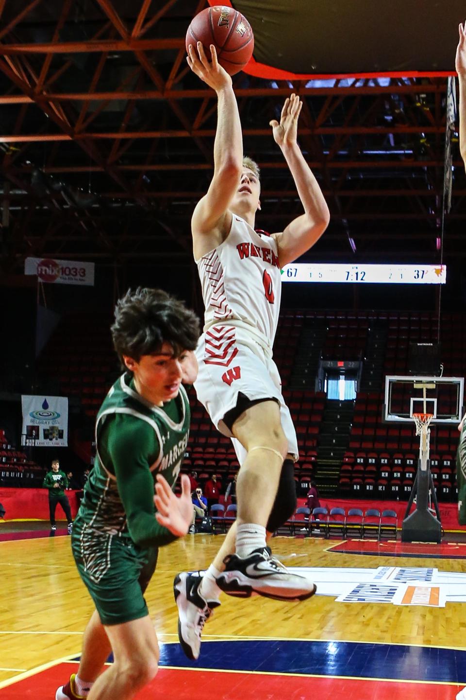 Joey Tomasso takes it to the basket for Waverly in a 75-43 loss to Marcellus in a NYSPHSAA Class B regional final March 10, 2024 at Visions Veterans Memorial Arena in Binghamton.