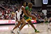 Stanford forward Kiki Iriafen, left, defends against Oregon center Phillipina Kyei during the first half of an NCAA college basketball game Sunday, Jan. 29, 2023, in Stanford, Calif. (AP Photo/Josie Lepe)