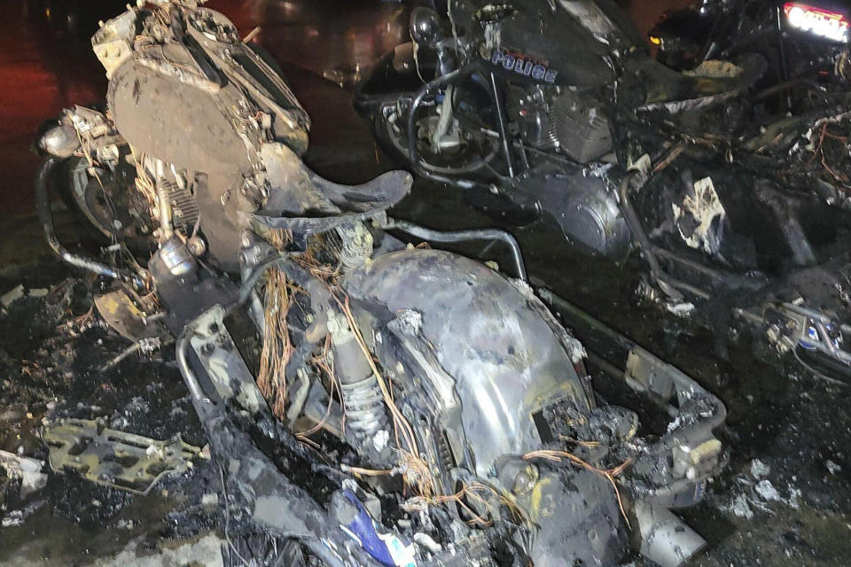 This photo provided by the Atlanta Police Department show torched police motorcycles after a July 1, 2023, attack at a police precinct in southeast Atlanta. Authorities on Thursday, Feb. 8, 2024, announced they have arrested John Robert Mazurek, 30, in connection with the attack and charged him with first-degree arson. (Atlanta Police Department via AP)