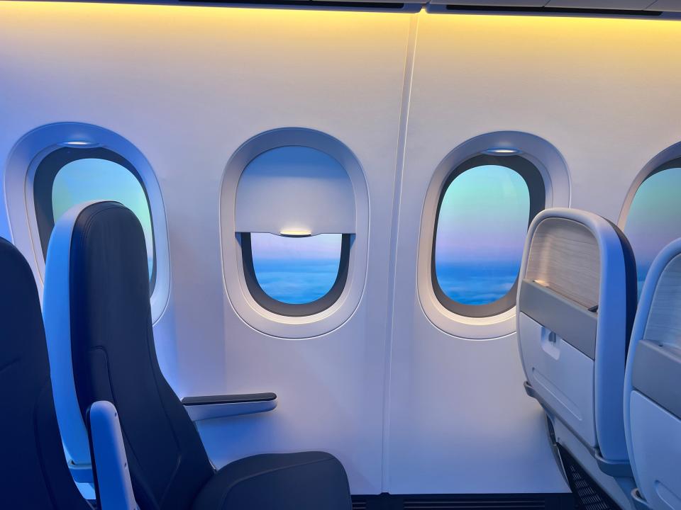 A view of the windows with shade half-closed in a Boeing 777X cabin mockup