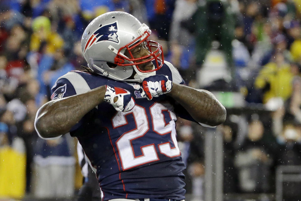 New England Patriots running back LeGarrette Blount celebrates his touchdown during the first half of an AFC divisional NFL playoff football game against the Indianapolis Colts in Foxborough, Mass., Saturday, Jan. 11, 2014. (AP Photo/Matt Slocum)