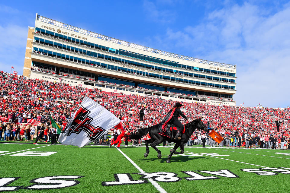 The Texas Tech Red Raiders mascot ‘Masked Rider’ runs down the field before a game against West Virginia. (AP)