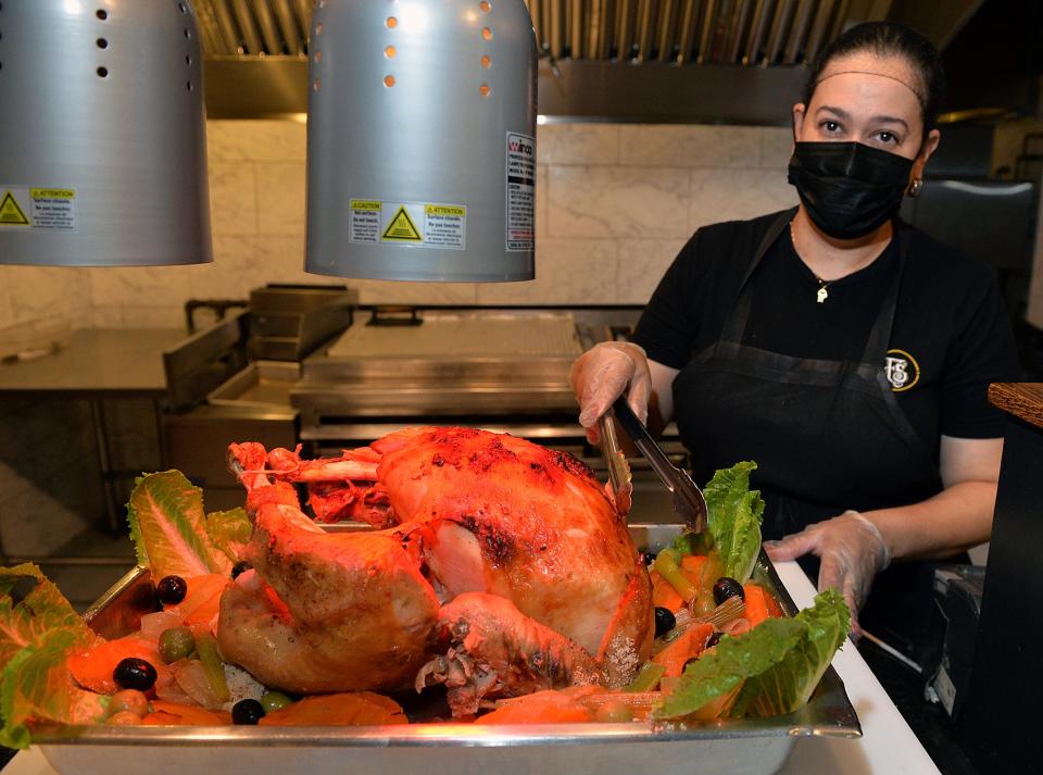 Framingham Station will be open on Thanksgiving Day. Here, Fran Medeiros shows off a slow roasted turkey, Nov. 12, 2021.