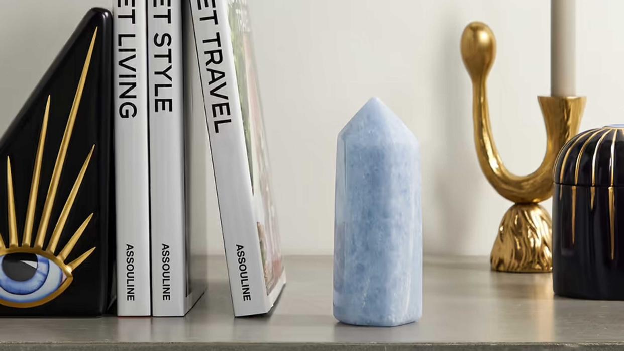  a blue crystal on a shelf 