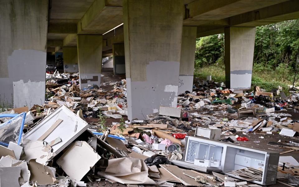 Mounds of rubbish dumped underneath the M8 motorway in Glasgow - Jeff J Mitchell/Getty