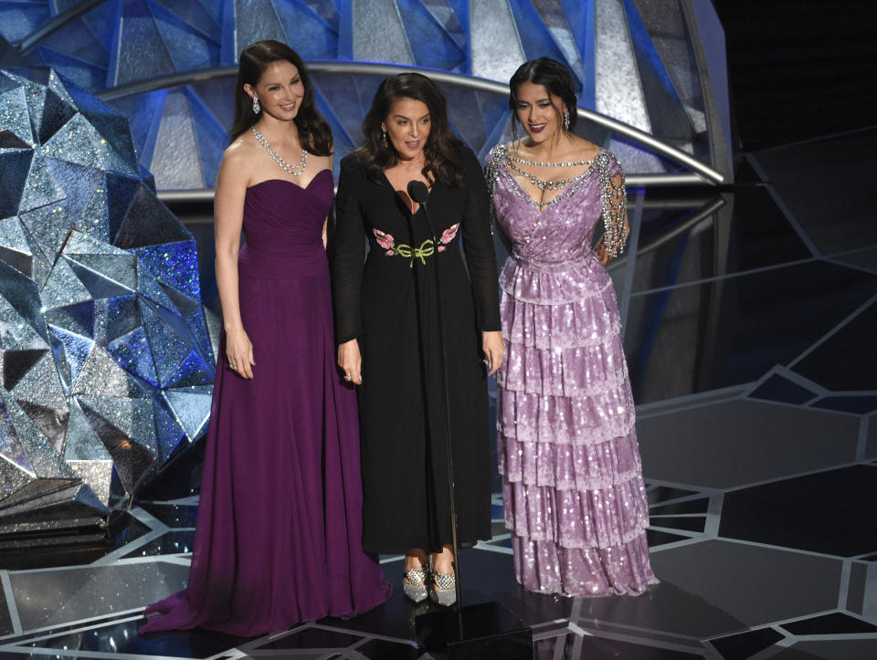 FILE - In this March 4, 2018 file photo, Harvey Weinstein accusers, Ashley Judd, from left, Annabella Sciorra and Salma Hayek speak at the Oscars in Los Angeles. (Photo by Chris Pizzello/Invision/AP, File)