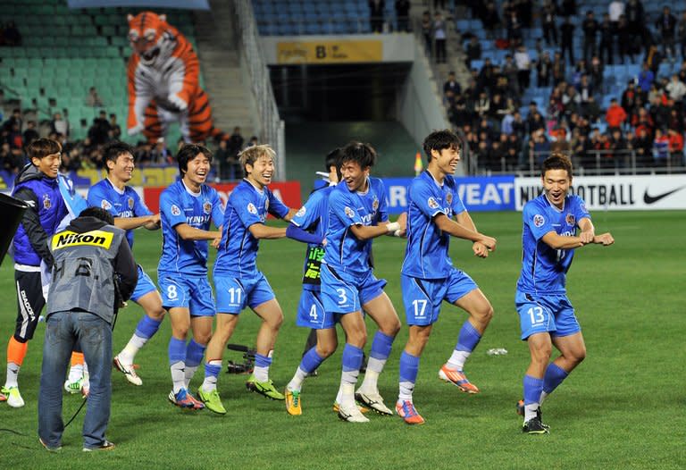 South Korea's Ulsan Hyundai players perform a 'Gangnam Style' dance after winning the AFC Champions League final against Saudi Arabia's Al Ahli in Ulsan last month