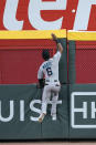 Miami Marlins center fielder Starling Marte (6) can't reach a ball hit for a three-run home run by Atlanta Braves' Dansby Swanson in the fourth inning of a baseball game Wednesday, Sept. 23, 2020, in Atlanta. (AP Photo/John Bazemore)