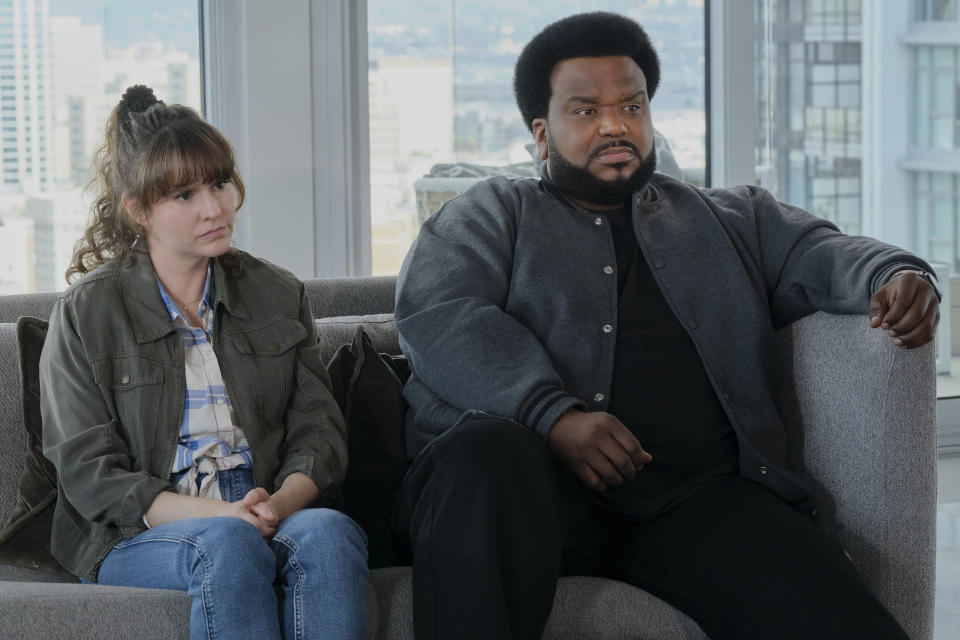 In this photo provided by Peacock, actors Claudia O'Doherty, left, as Jillian, and Craig Robinson, as Craig, appear in a scene for season two of "Killing It." (Trae Patton//Peacock via AP)