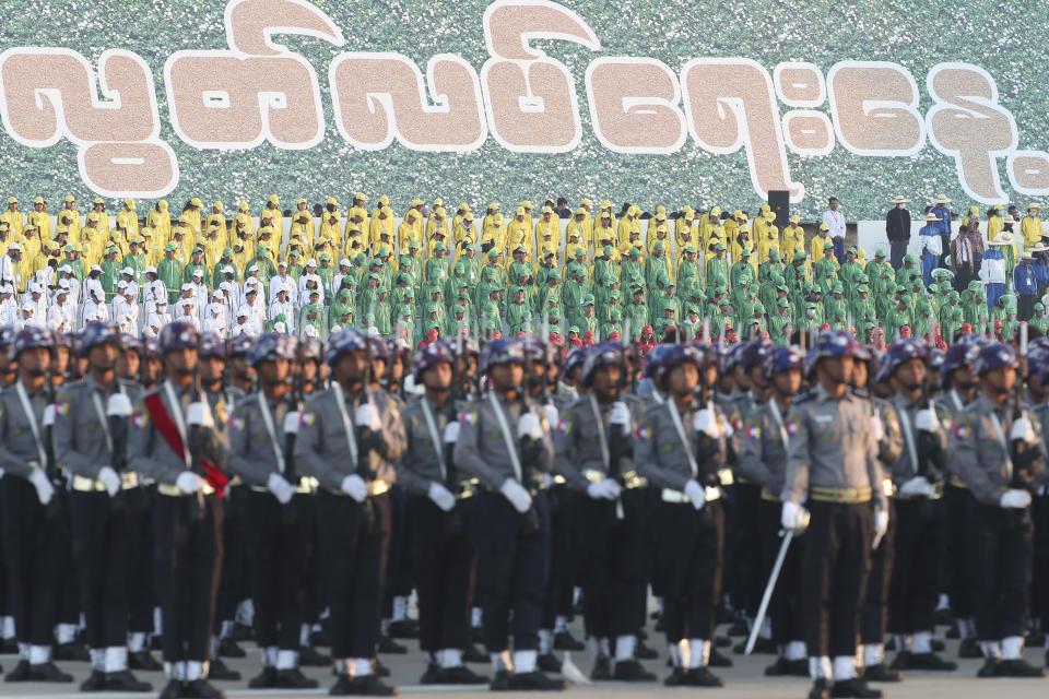 State school students attend a ceremony marking Myanmar's 75th anniversary of Independence Day in Naypyitaw, Myanmar, Wednesday, Jan. 4, 2023. Myanmar's ruling military leader, Senior Gen. Min Aung Hlaing, on Wednesday described plans for an election later this year and called for national unity in a speech as he led a ceremony marking the 75th anniversary of independence from Britain. The words on the background read "Independence Day." (AP Photo/Aung Shine Oo)