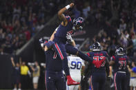 Houston Texans quarterback Deshaun Watson (4) celebrates with teammates after conceding on a pass with wide receiver DeAndre Hopkins (10) for a touchdown against the Indianapolis Colts during the first half of an NFL football game Thursday, Nov. 21, 2019, in Houston. (AP Photo/Eric Christian Smith)