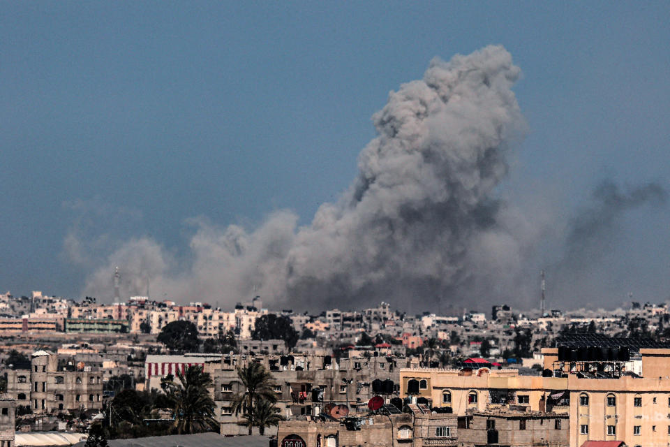 TOPSHOT - This picture taken from Rafah in the southern Gaza Strip shows smoke billowing during Israeli bombardment on Khan Yunis on February 22, 2024, amid continuing battles between Israel and the Palestinian militant group Hamas. (Photo by SAID KHATIB / AFP) (Photo by SAID KHATIB/AFP via Getty Images)