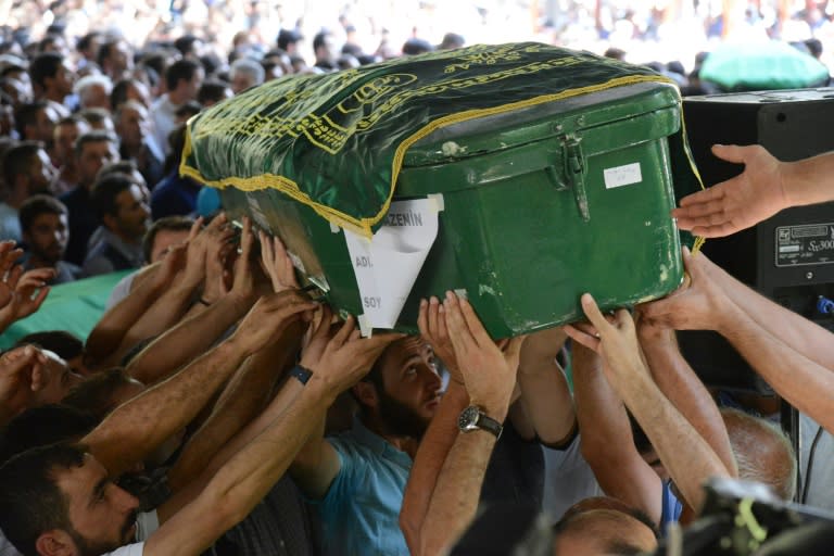 Mourners carry a coffin during a funeral for victims of an attack on a wedding party that left 50 dead in Gaziantep, southeastern Turkey, on August 21, 2016