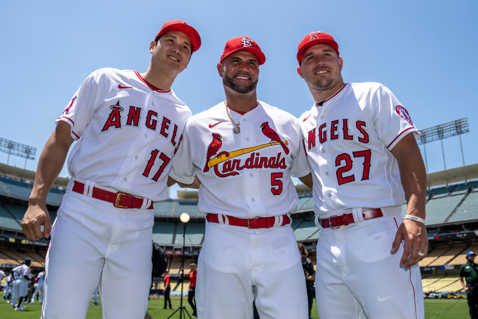 LOS ANGELES, CA - JULY 18: Shohei Ohtani #17 and Mike Trout #27 of the Los Angeles Angels pose for a photo with Albert Pujols #5 of the St. Louis Cardinals during the Gatorade All-Star Workout Day at Dodger Stadium on Tuesday, July 18, 2022 in Los Angeles, California. (Photo by Brace Hemmelgarn/Minnesota Twins/Getty Images)