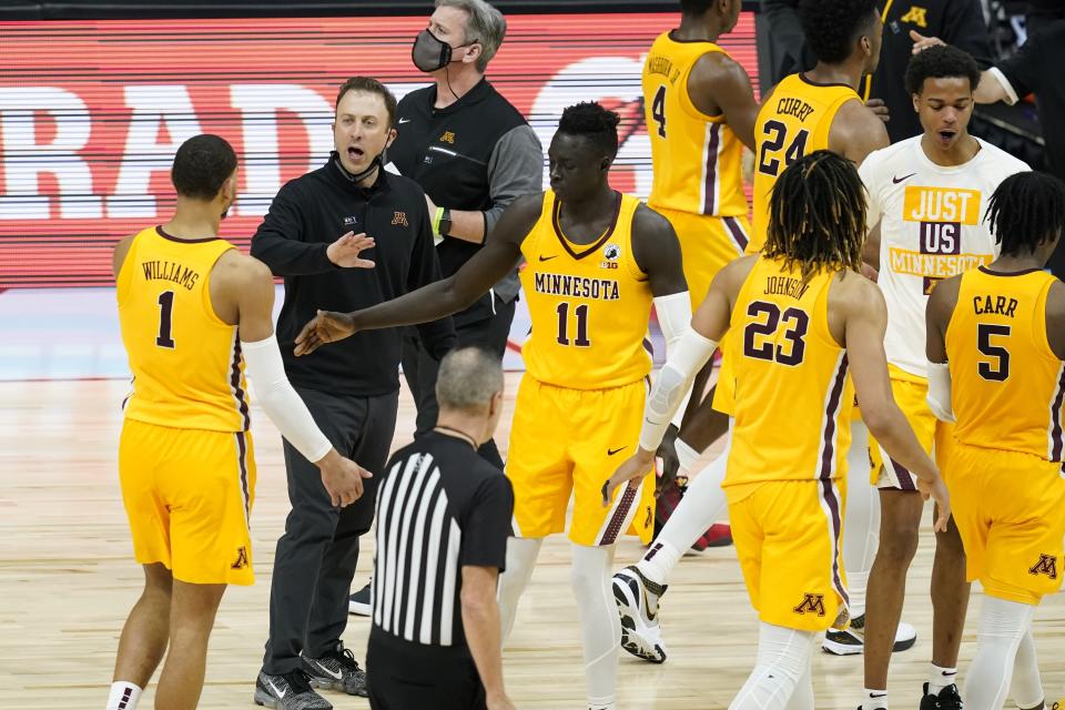 Minnesota head coach Richard Pitino greets players during the second half of an NCAA college basketball game against Northwestern at the Big Ten Conference tournament, Wednesday, March 10, 2021, in Indianapolis. (AP Photo/Darron Cummings)