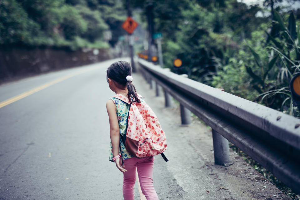 Little girl walking around on the country road in Taiwan