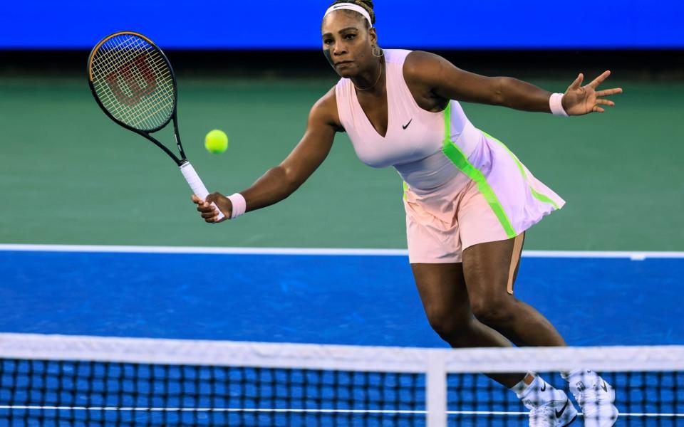 Emma Raducanu, of Britain, returns a shot to Serena Williams, - AP